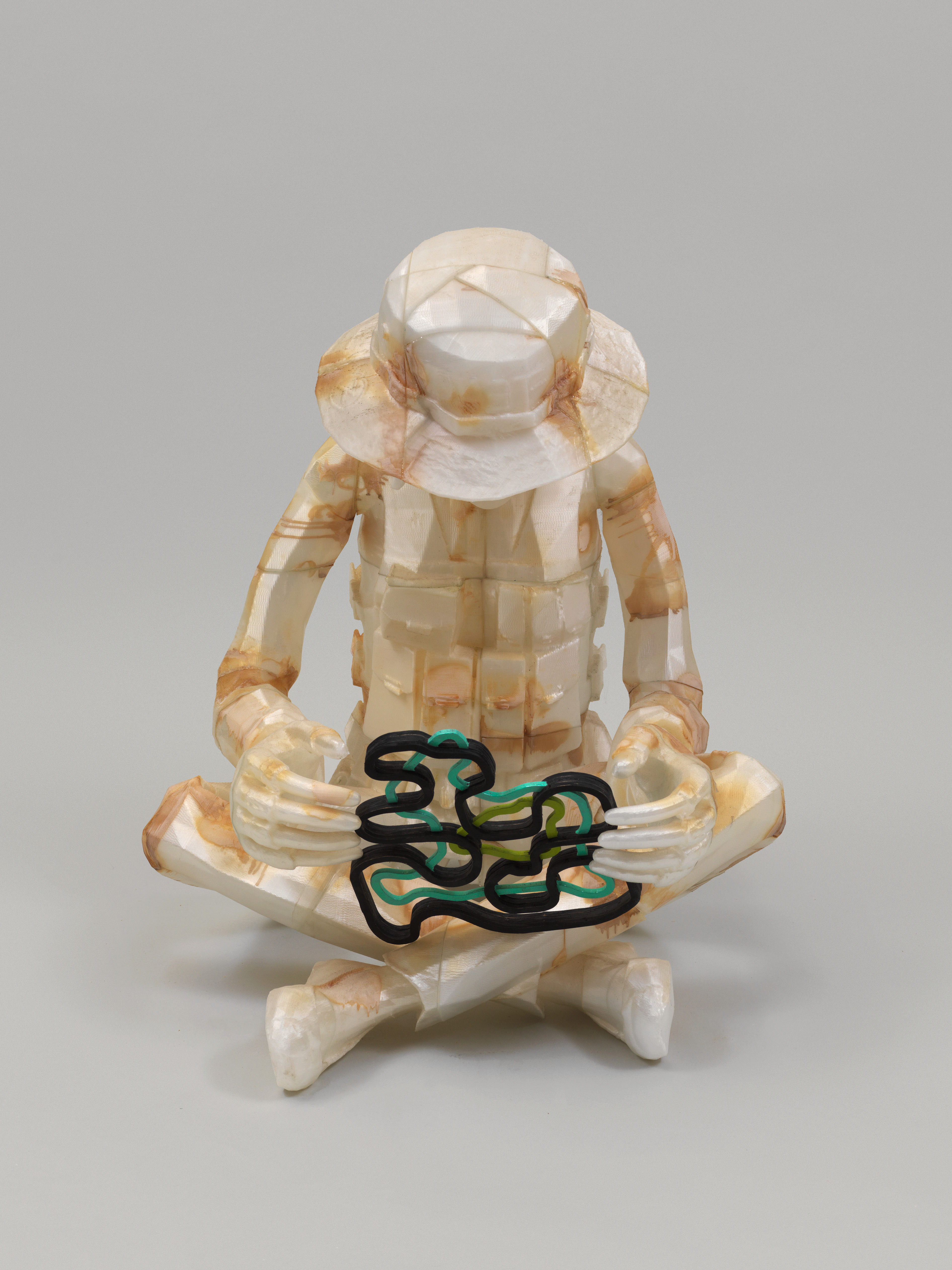 Child Soldier Examining Fun Shape — image 1 of 3